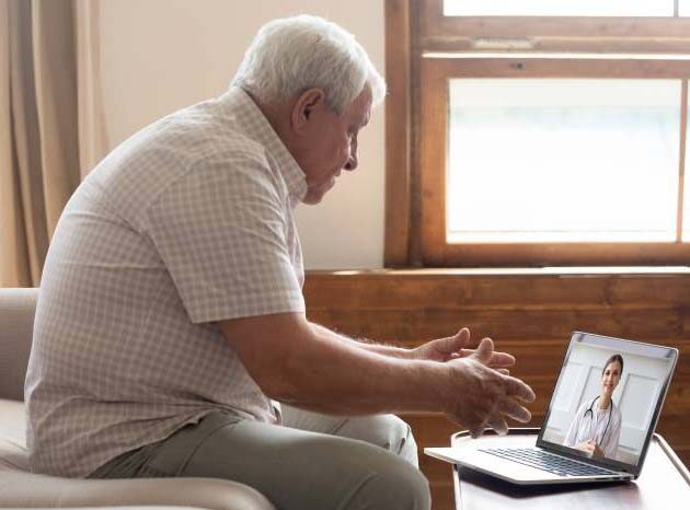 home-elderly-man-video-chat-virtual-care-Cecelia-Health