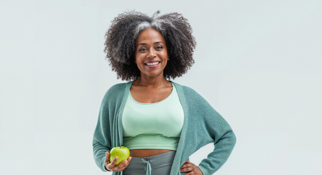 Woman fit holding apple weight_2