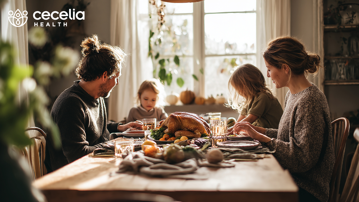 family sitting at the table eating dinner