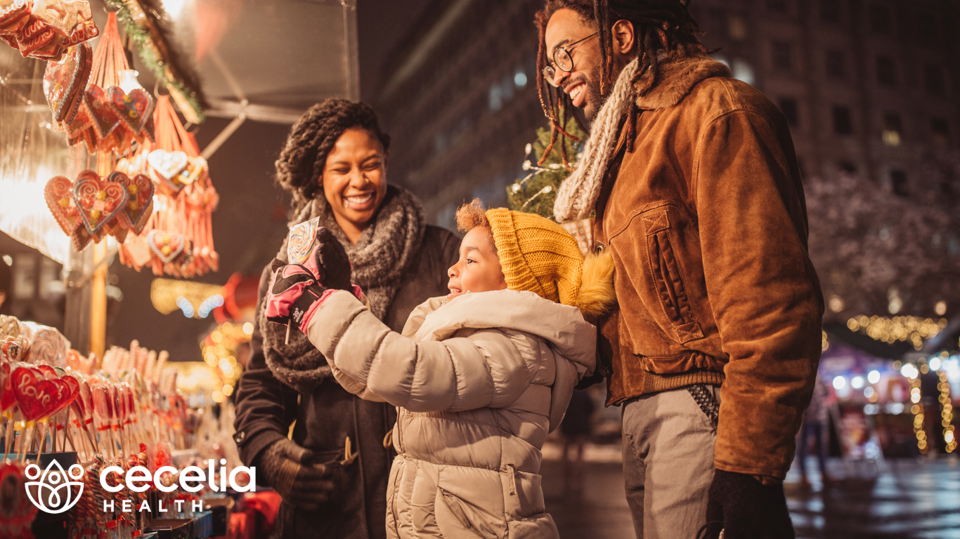 family at an outdoors holiday market