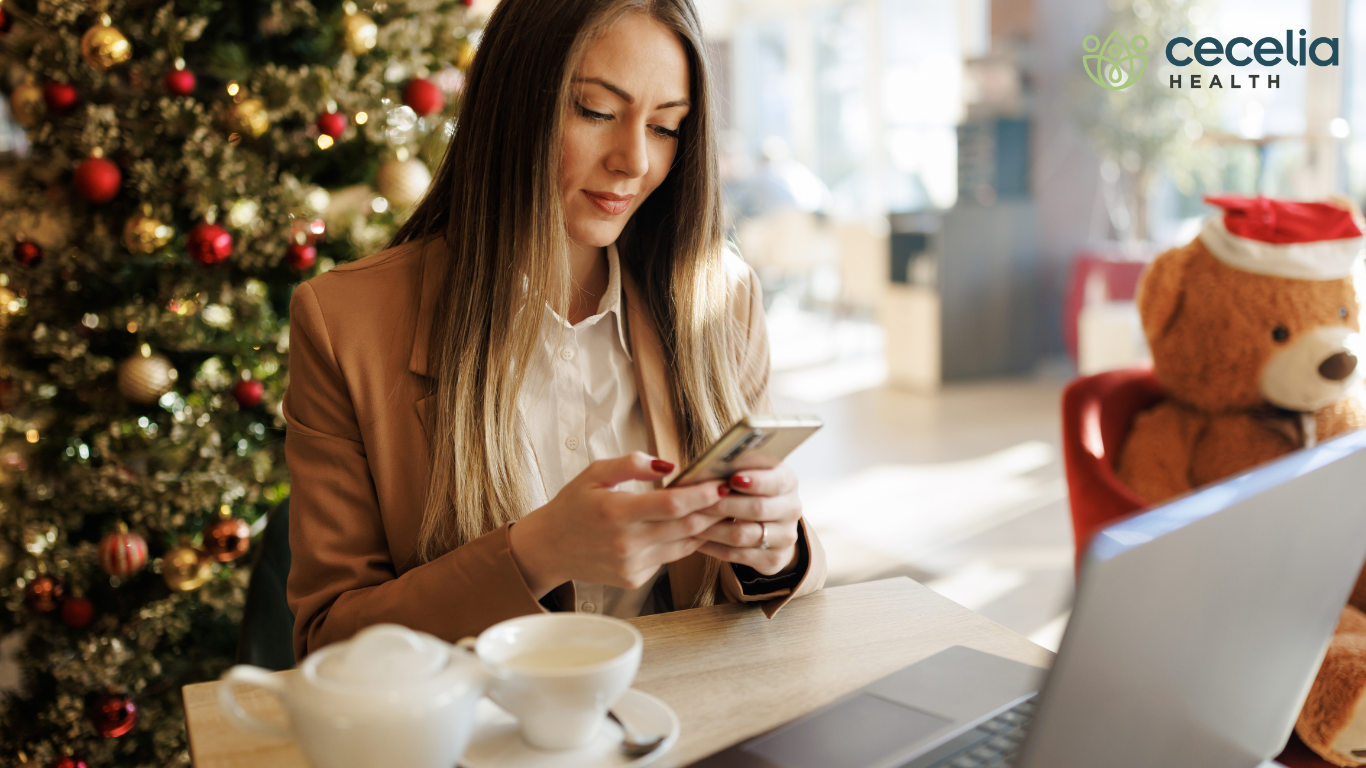 woman sitting in front of a christmas tree