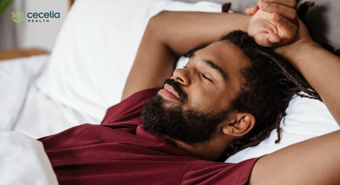man sleeping comfortably in bed