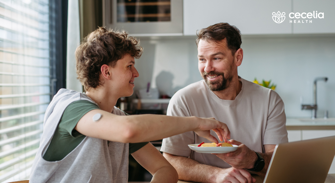man offering snack to person wearing CGM