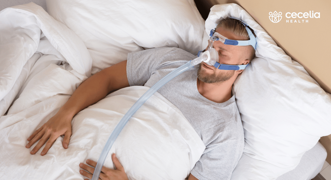 man in bed with CPAP machine