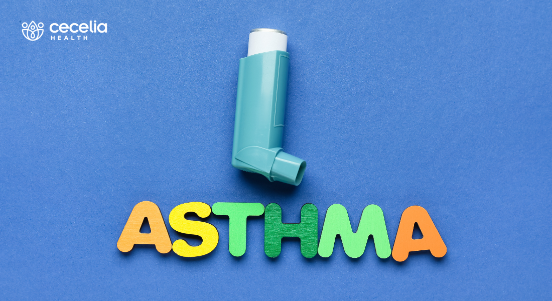 inhaler on blue background with the word asthma spelled out