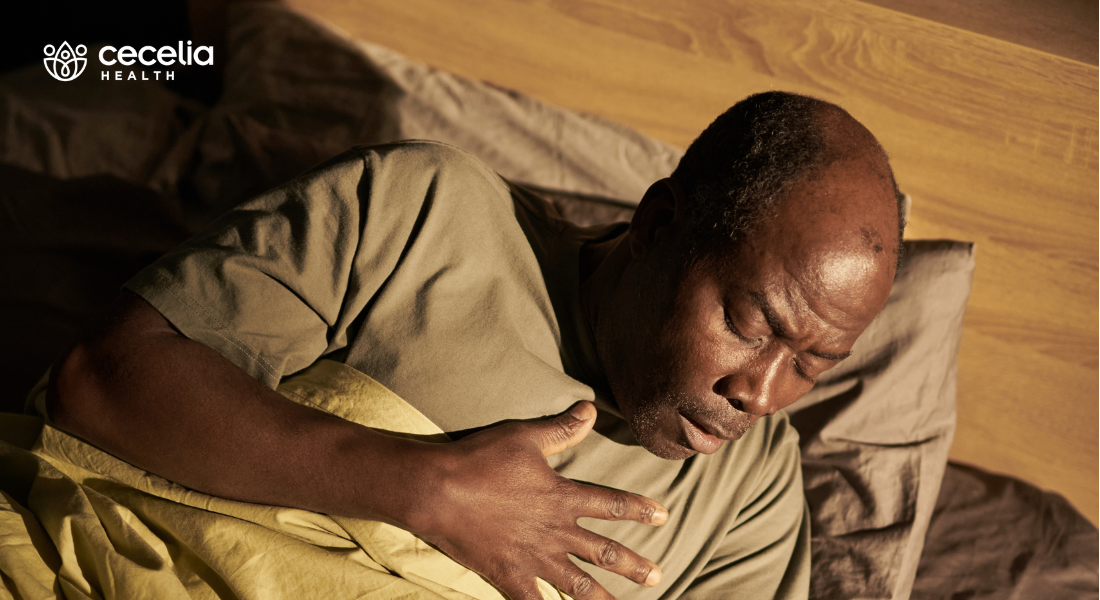 man in bed having asthma attack
