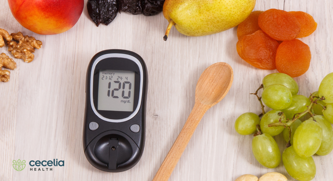 blood glucose meter with fruit around it