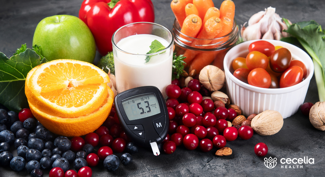 fruits and vegetables on a table with blood glucose monitor