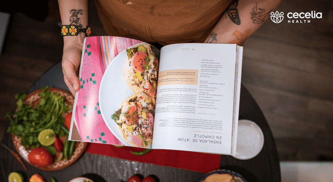 person looking at an open cookbook