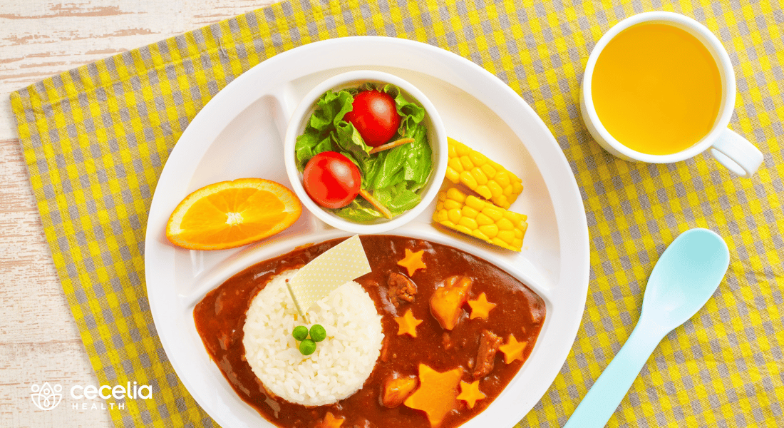 kid lunch of vegetables and juice
