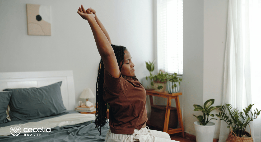 woman in bed doing stretches