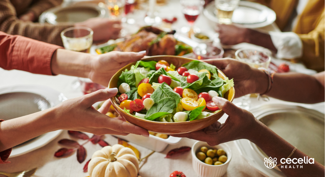 salad being passed at fall table dinner