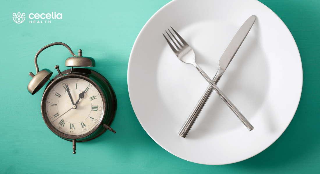 empty plate next to an alarm clock