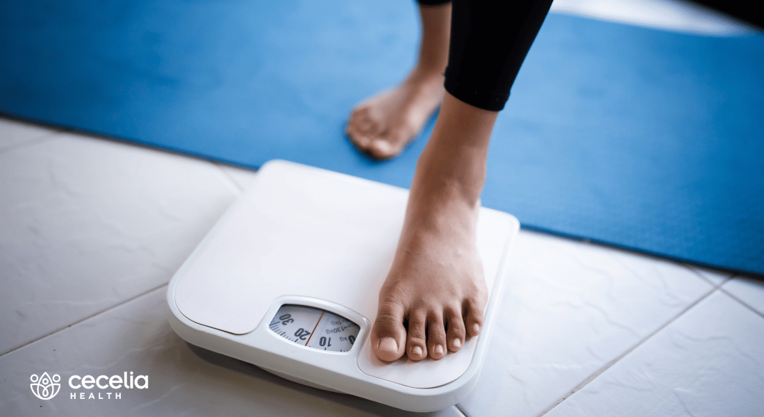 person stepping on the scale