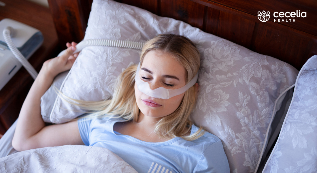 woman sleeping peacefully wearing cpap device